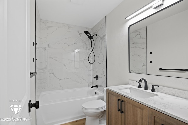 bathroom featuring toilet, vanity, and shower / bath combination