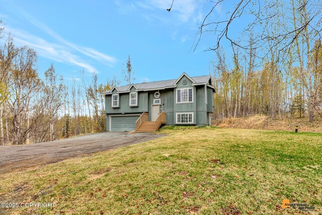 2751 N Barrys Resort Dr, Wasilla, AK 99654 - split foyer home with a garage, a front lawn, and aphalt driveway