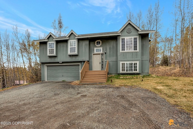 2751 N Barrys Resort Dr, Wasilla, AK 99654 - raised ranch featuring dirt driveway and an attached garage