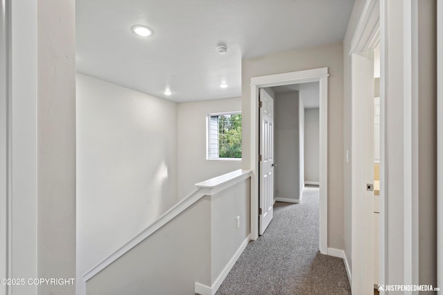 corridor featuring carpet, recessed lighting, an upstairs landing, and baseboards