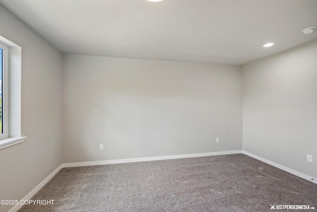 empty room with recessed lighting, baseboards, and carpet floors