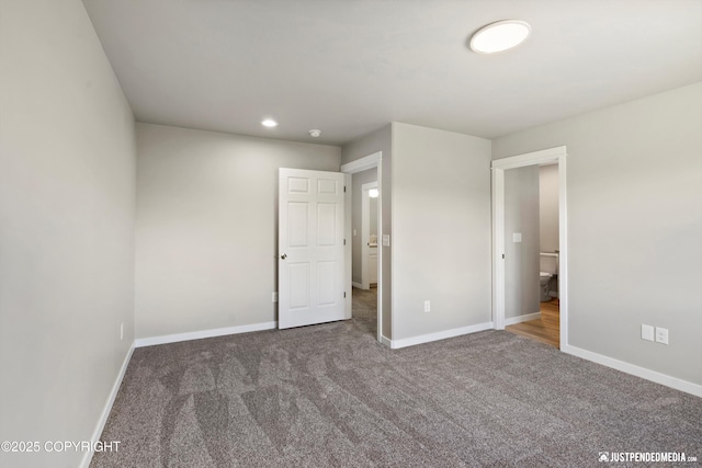 unfurnished bedroom with recessed lighting, baseboards, and carpet