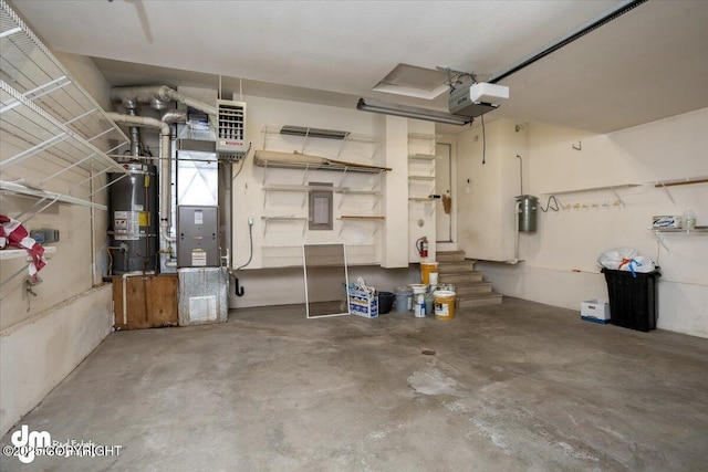 garage featuring strapped water heater, heating unit, and a garage door opener