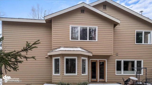 back of property with a patio area