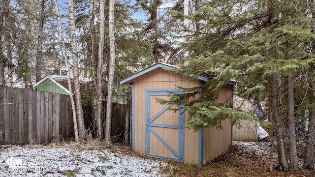 view of shed with fence