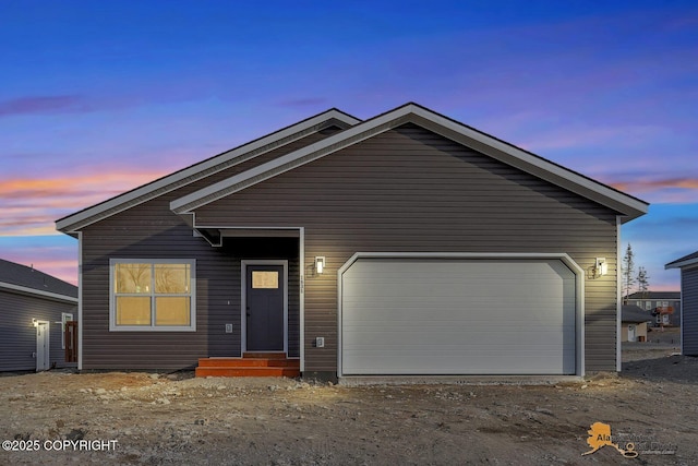 view of front of property with an attached garage and driveway