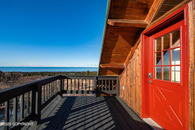 wooden terrace with a water view