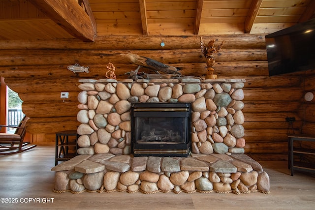 interior details featuring rustic walls, wood finished floors, beam ceiling, and wooden ceiling