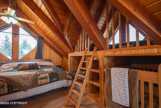 bedroom featuring lofted ceiling with beams, wooden walls, wood ceiling, and wood finished floors