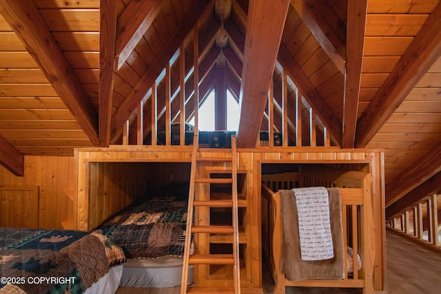 bedroom featuring wooden walls, wood ceiling, wood finished floors, and vaulted ceiling with beams