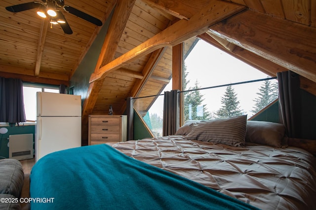 bedroom with multiple windows, wooden ceiling, vaulted ceiling with beams, and freestanding refrigerator