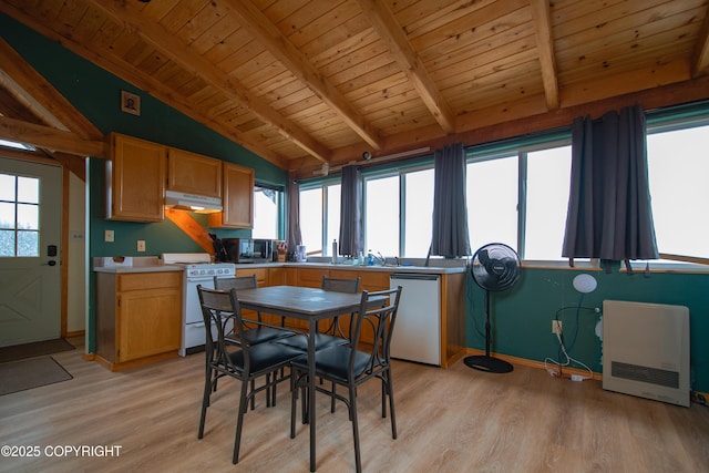 dining area featuring plenty of natural light, light wood-style flooring, and lofted ceiling with beams