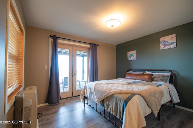 bedroom with access to exterior, french doors, baseboards, and wood finished floors