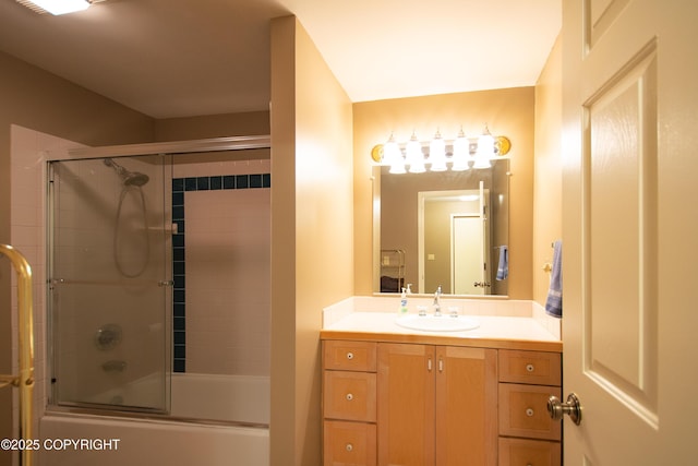 bathroom with shower / bath combination with glass door and vanity