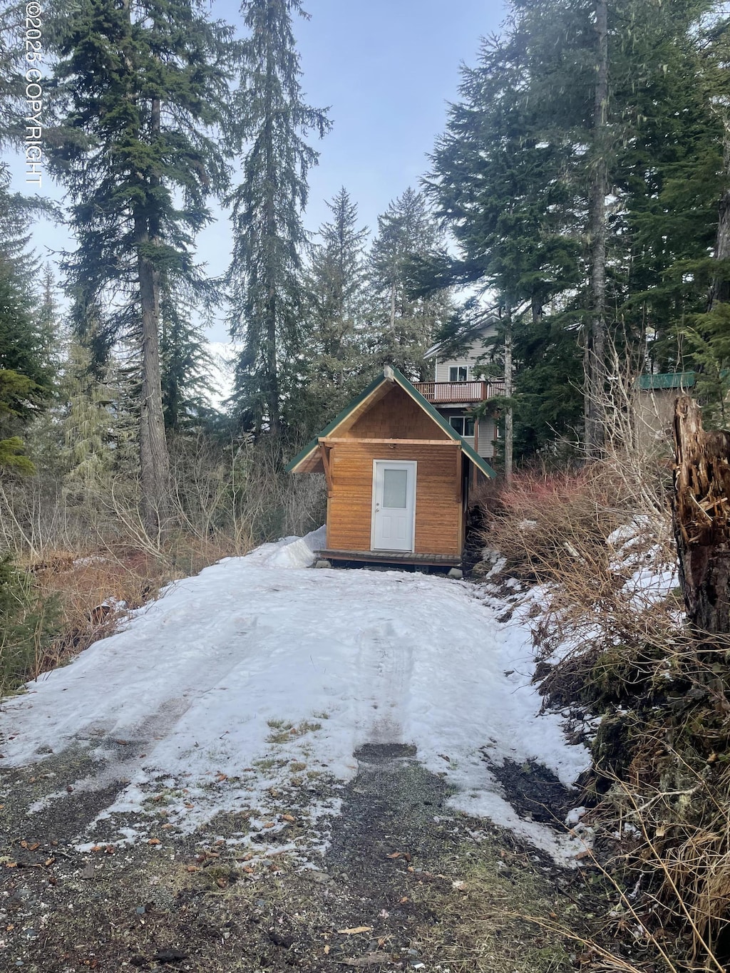 view of side of home with an outbuilding