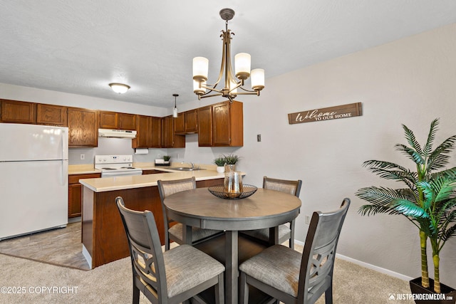 dining space with baseboards, light carpet, and a chandelier