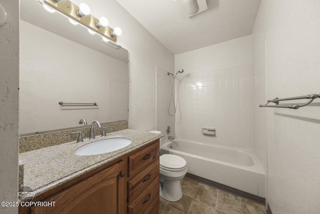 full bathroom featuring vanity, a textured ceiling, bathing tub / shower combination, toilet, and a textured wall