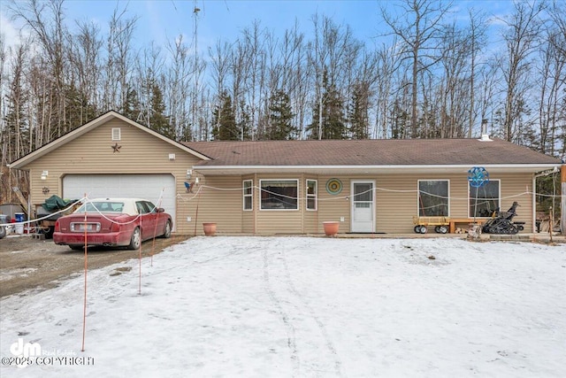 ranch-style house featuring an attached garage