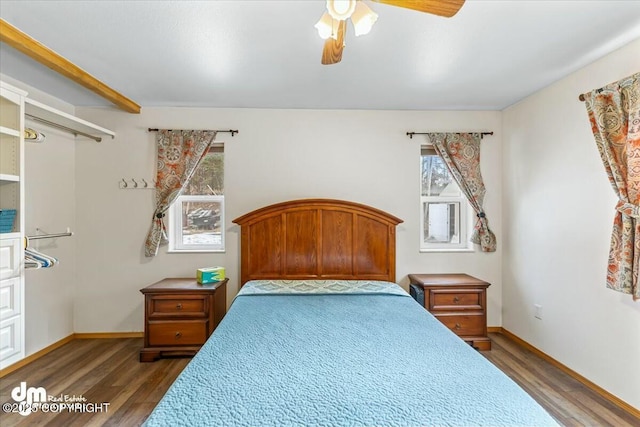 bedroom with baseboards, wood finished floors, and a ceiling fan