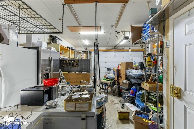 garage with stainless steel fridge with ice dispenser