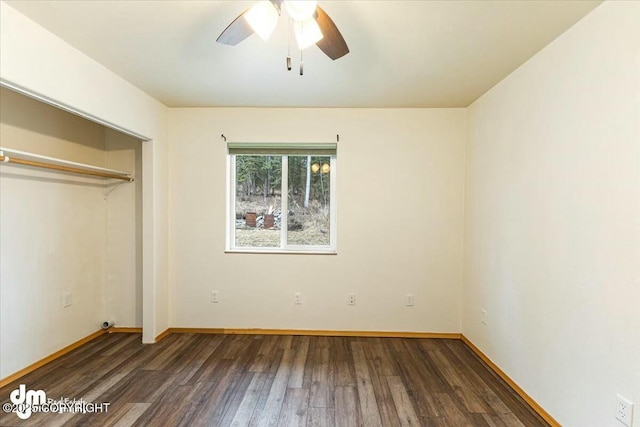 unfurnished bedroom with baseboards, a ceiling fan, wood finished floors, and a closet