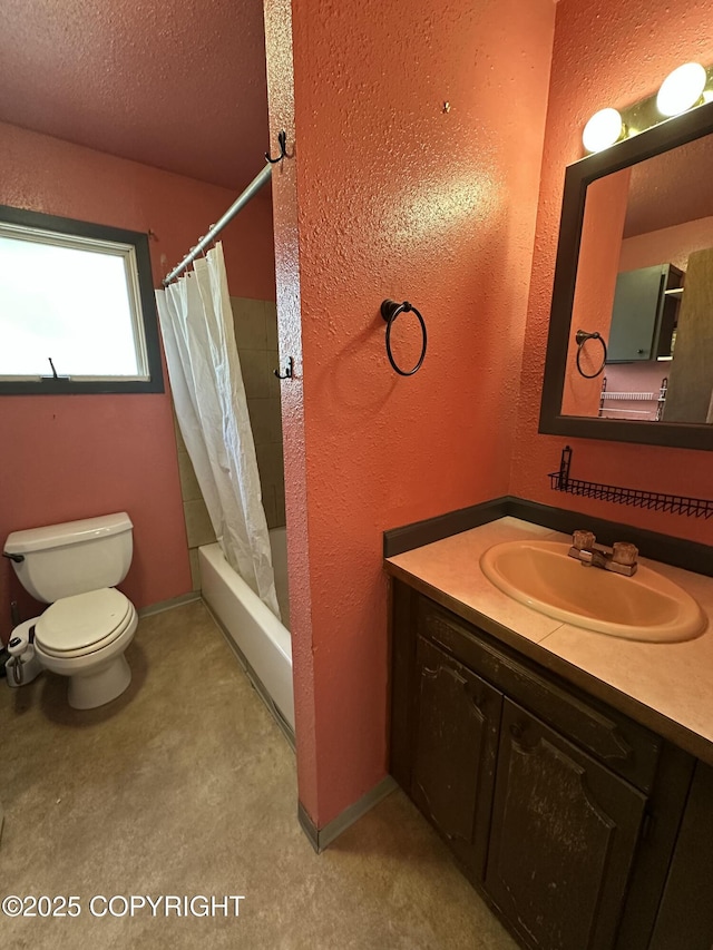 bathroom with toilet, shower / bath combo, baseboards, vanity, and a textured wall