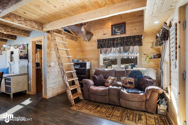 living room with beam ceiling, wood walls, wood ceiling, and wood finished floors