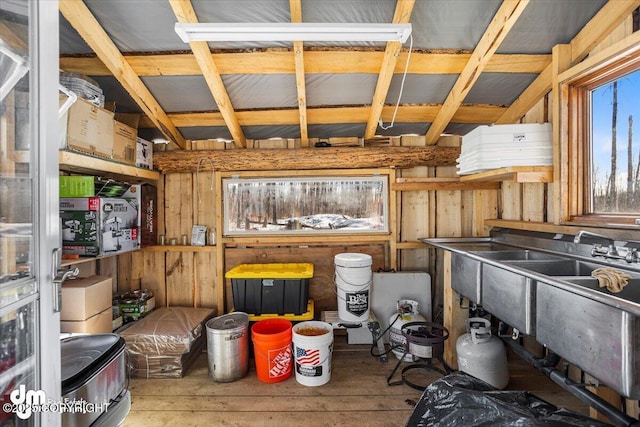 kitchen featuring wooden walls and wood-type flooring