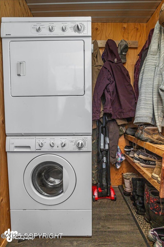 laundry room featuring stacked washer / drying machine