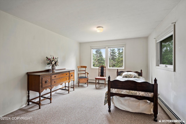 carpeted bedroom featuring baseboards, a baseboard radiator, and multiple windows