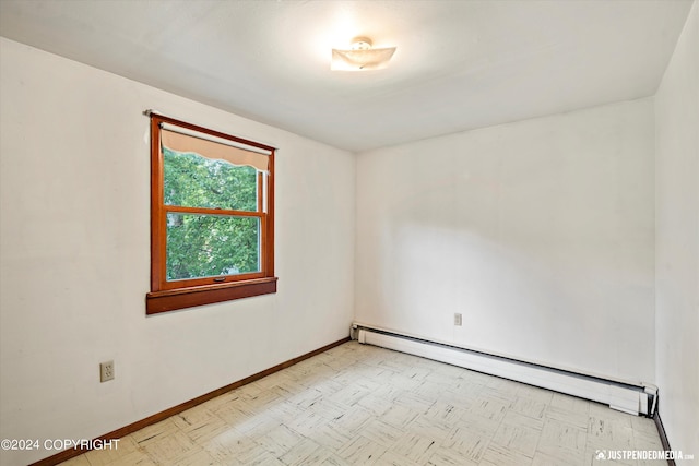 empty room with baseboards and baseboard heating