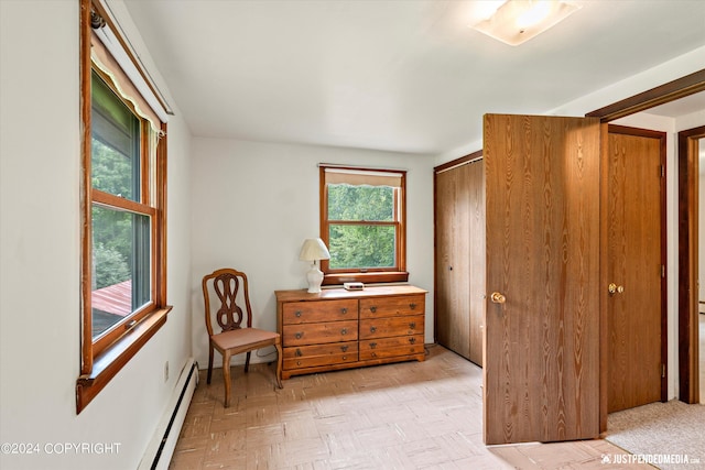 sitting room featuring baseboard heating