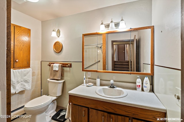 full bathroom featuring vanity, a baseboard heating unit, and toilet