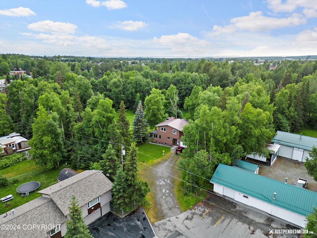 birds eye view of property with a wooded view