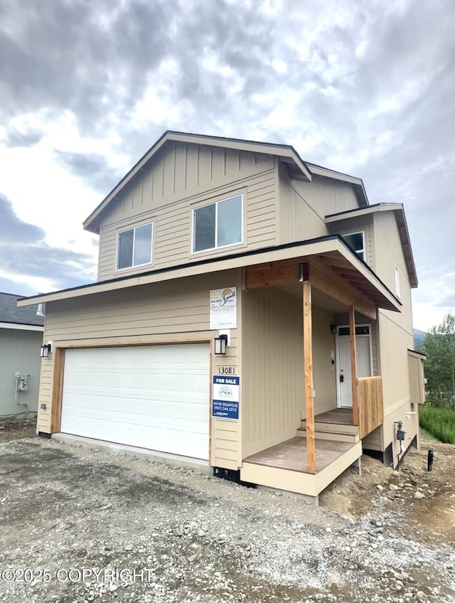 13081 Chase Cir, Eagle River, AK 99577 - view of front of house featuring a garage and driveway