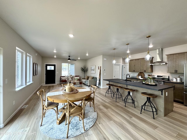 698 Wortham Ave, Kenai, AK 99611 - dining room with light wood-type flooring, ceiling fan, and recessed lighting