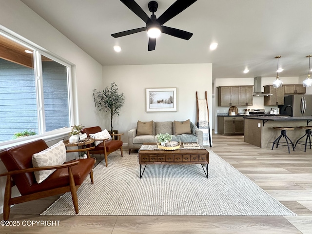 698 Wortham Ave, Kenai, AK 99611 - living area featuring light wood-style floors, ceiling fan, and recessed lighting