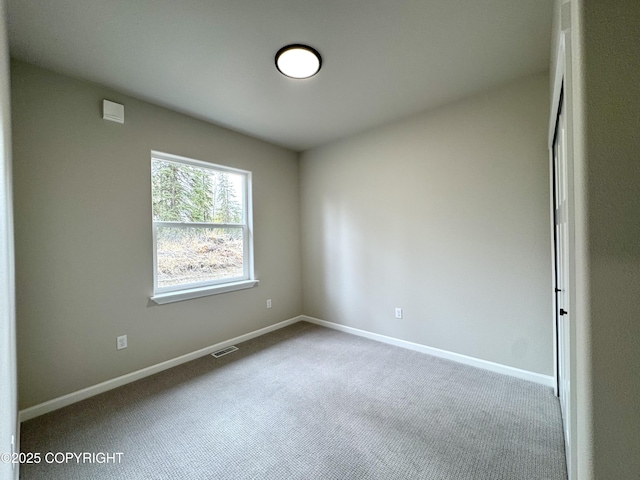 698 Wortham Ave, Kenai, AK 99611 - carpeted spare room with baseboards