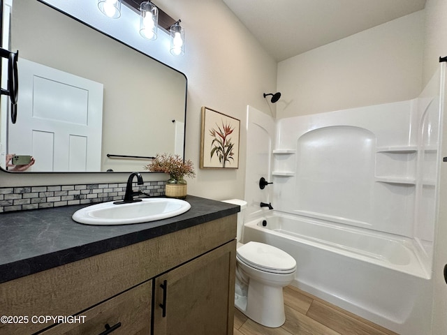 698 Wortham Ave, Kenai, AK 99611 - bathroom with vanity,  shower combination, and wood finished floors