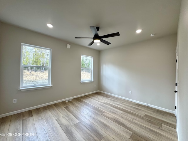698 Wortham Ave, Kenai, AK 99611 - spare room with light wood-style floors, ceiling fan, and recessed lighting