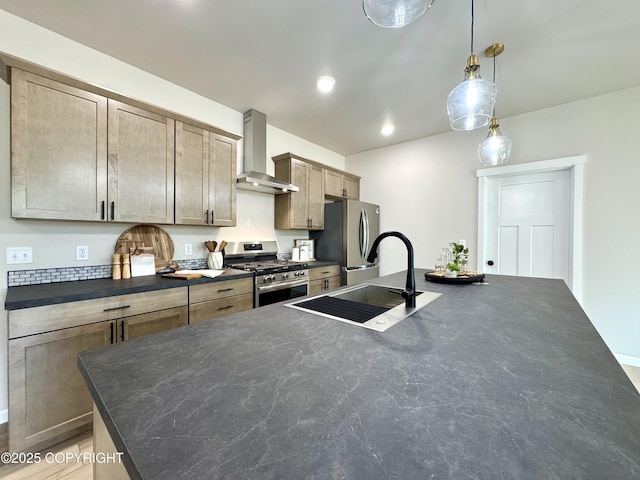 698 Wortham Ave, Kenai, AK 99611 - kitchen featuring stainless steel appliances, wall chimney range hood, hanging light fixtures, a center island with sink, and recessed lighting
