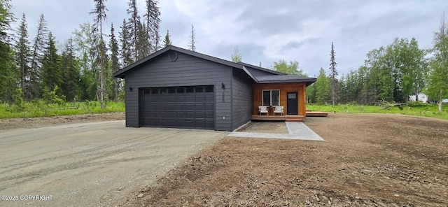 698 Wortham Ave, Kenai, AK 99611 - view of front of property featuring an attached garage and driveway