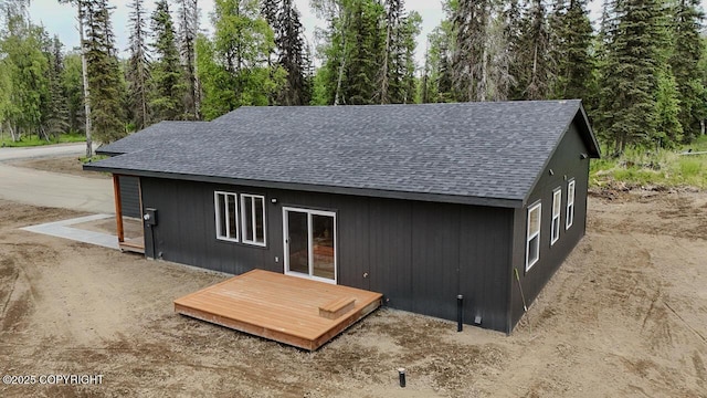 698 Wortham Ave, Kenai, AK 99611 - exterior space featuring a shingled roof and a wooden deck