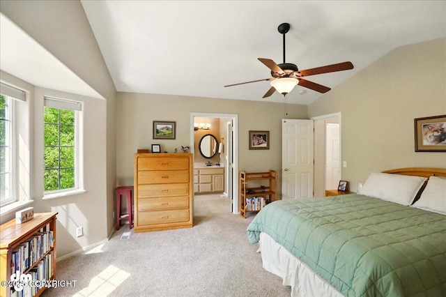 19016 Mountain Point Cir, Eagle River, AK 99577 - bedroom featuring lofted ceiling, light colored carpet, baseboards, connected bathroom, and a ceiling fan