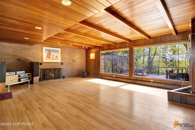 204 E 15th Ave, Anchorage, AK 99501 - unfurnished living room featuring wooden ceiling with exposed beams, a brick fireplace, plenty of natural light, wood finished floors, and a baseboard heating unit