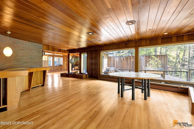 204 E 15th Ave, Anchorage, AK 99501 - unfurnished dining area with wooden ceiling, wood walls, and light wood-style flooring