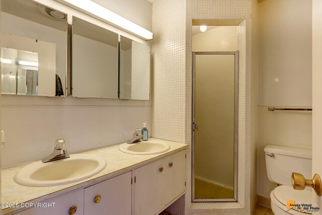 204 E 15th Ave, Anchorage, AK 99501 - full bathroom with toilet, a shower stall, and double vanity
