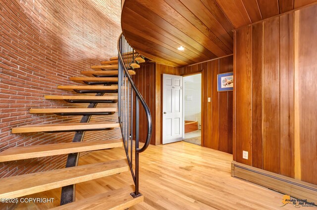 204 E 15th Ave, Anchorage, AK 99501 - staircase featuring wooden ceiling, wood walls, and wood finished floors