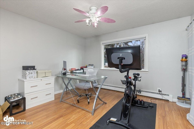 4801 Carousel Cir, Anchorage, AK 99502 - exercise room featuring light wood finished floors, a textured ceiling, baseboards, and ceiling fan