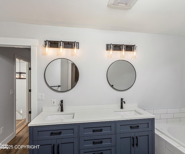 25656 Bendilent Cir, Eagle River, AK 99577 - bathroom featuring double vanity, a sink, and visible vents